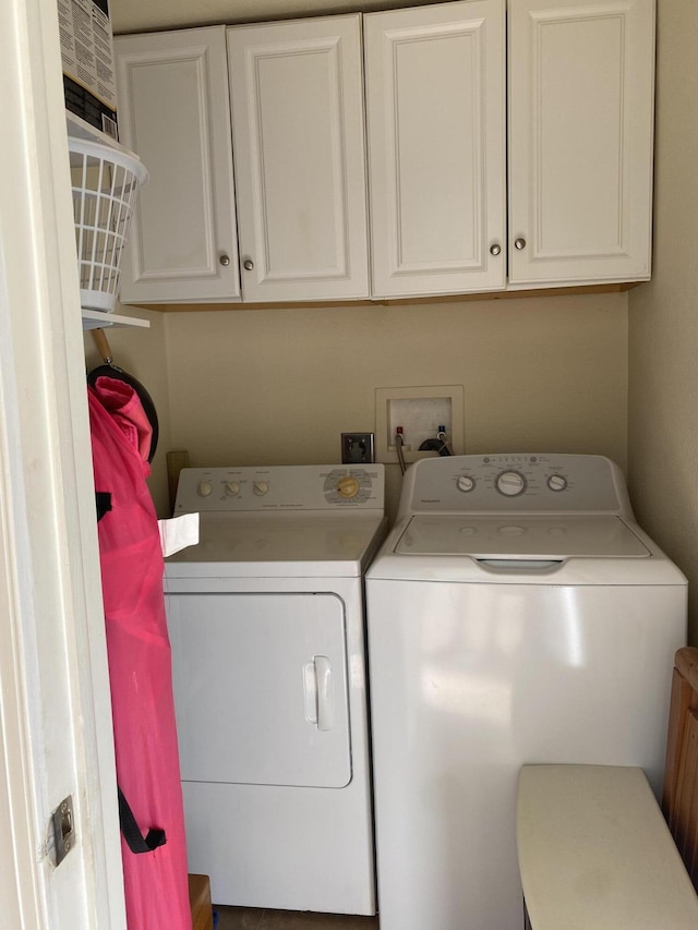 clothes washing area with washer and dryer