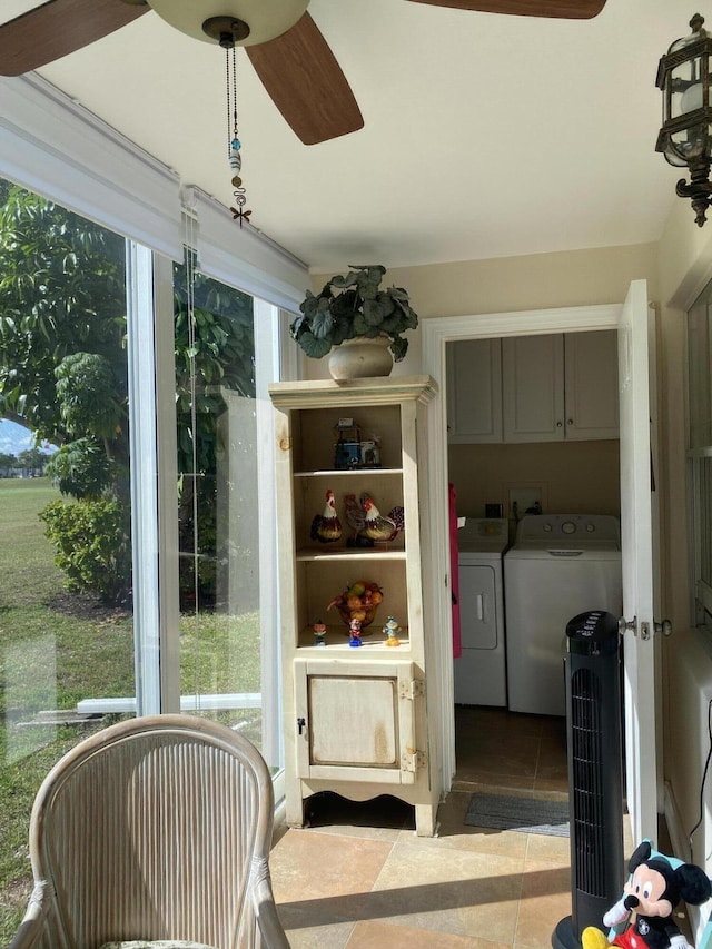 sunroom / solarium with washer and clothes dryer and ceiling fan