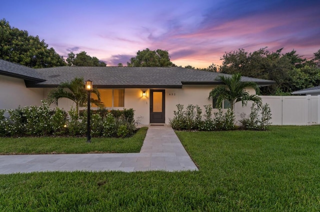 view of front of house with a lawn