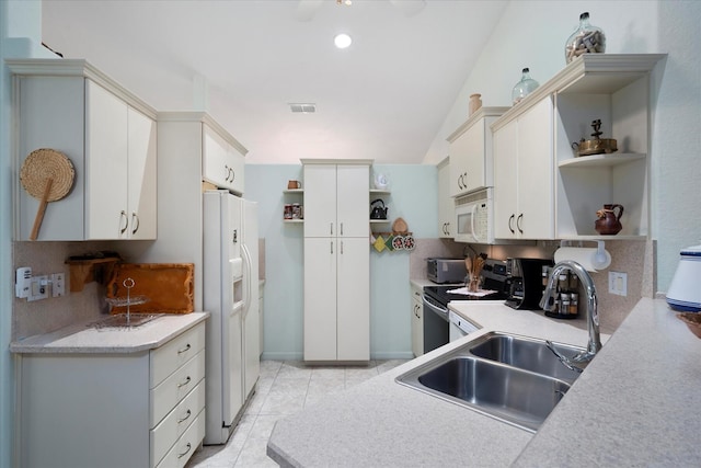 324 NE Gladiola Ave, Port Saint Lucie, FL 34983 - kitchen featuring white cabinetry, sink, backsplash, light tile patterned floors, and white appliances