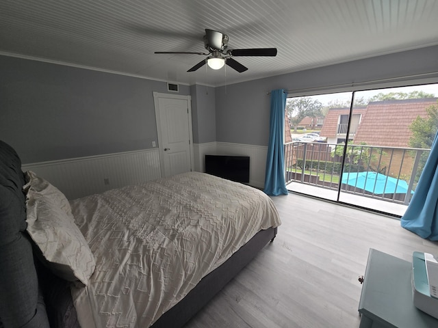 bedroom featuring light wood-type flooring, access to exterior, crown molding, and ceiling fan