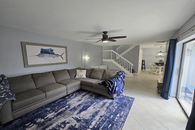 tiled living room with ceiling fan