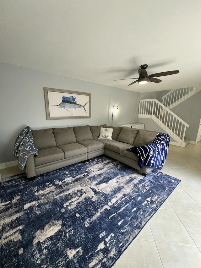 tiled living room featuring ceiling fan