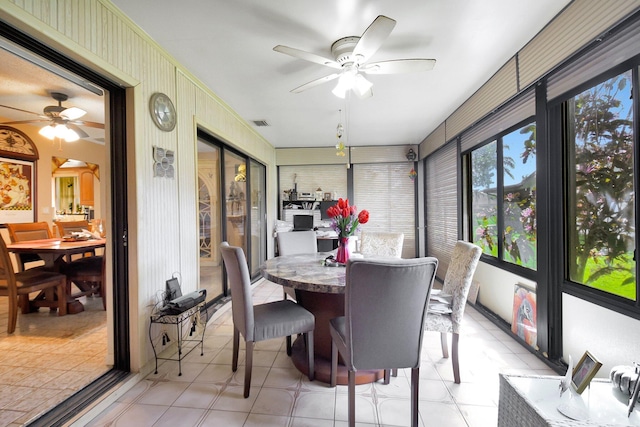 sunroom / solarium with ceiling fan
