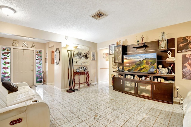living room with a textured ceiling