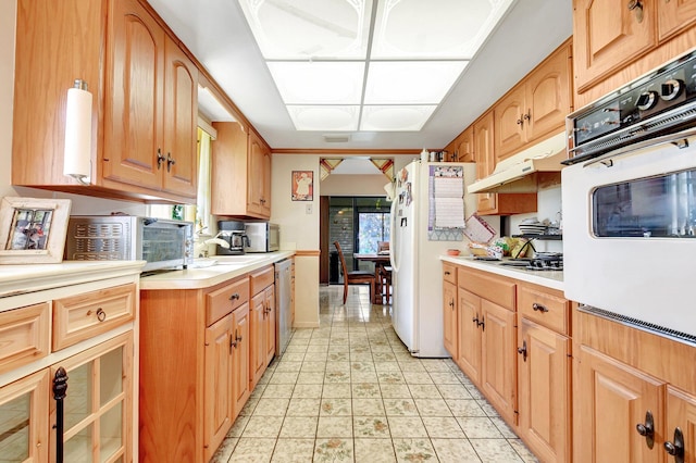 kitchen featuring appliances with stainless steel finishes, a healthy amount of sunlight, and sink