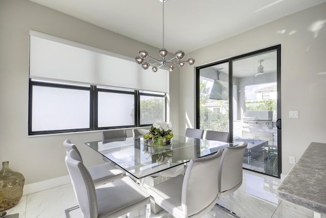 dining room with a wealth of natural light and an inviting chandelier