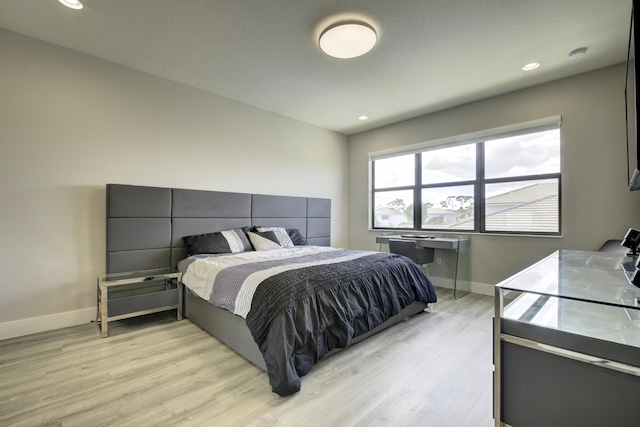 bedroom featuring light hardwood / wood-style floors