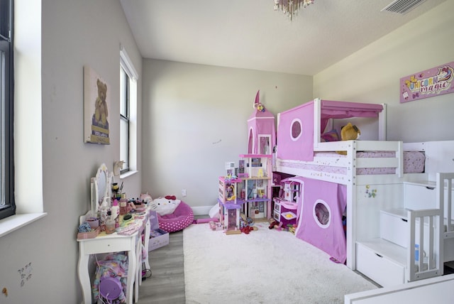 bedroom with light wood-type flooring