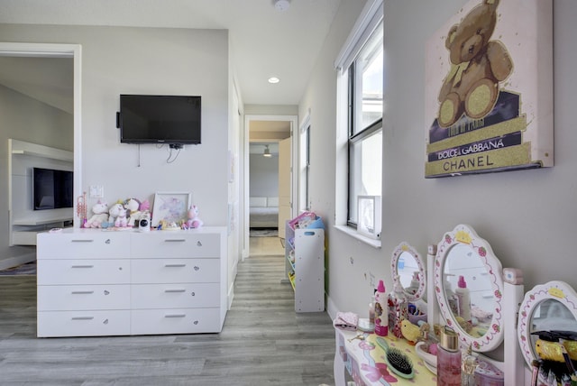 recreation room with light hardwood / wood-style flooring