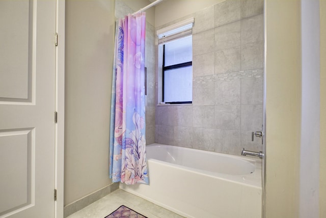 bathroom featuring shower / bathtub combination with curtain and tile patterned floors