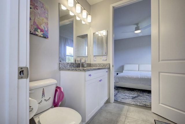 bathroom featuring vanity, ceiling fan, tile patterned floors, and toilet