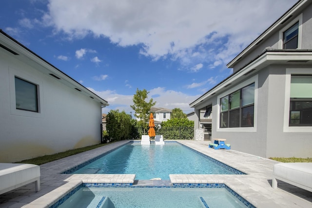 view of pool featuring a patio area