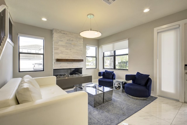 living room featuring a fireplace