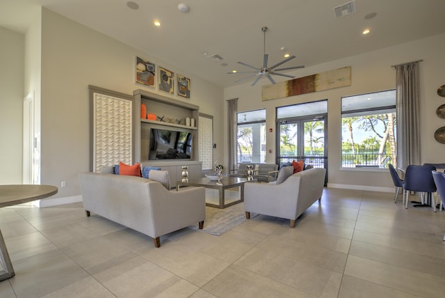 living room featuring french doors and light tile patterned floors