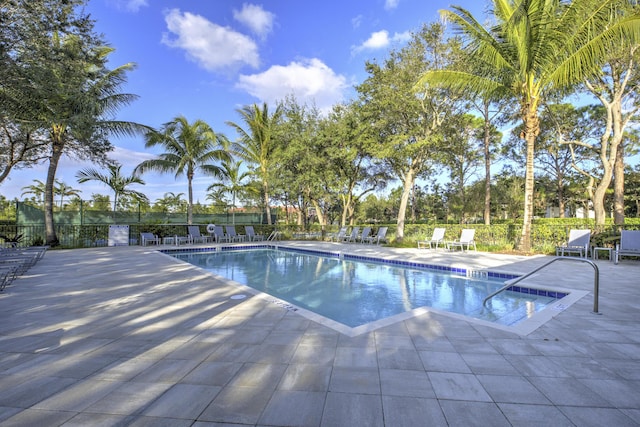 view of swimming pool featuring a patio area