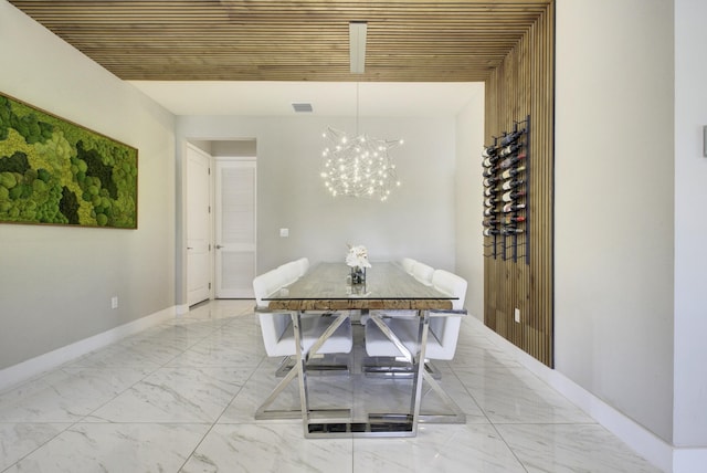 dining space with an inviting chandelier