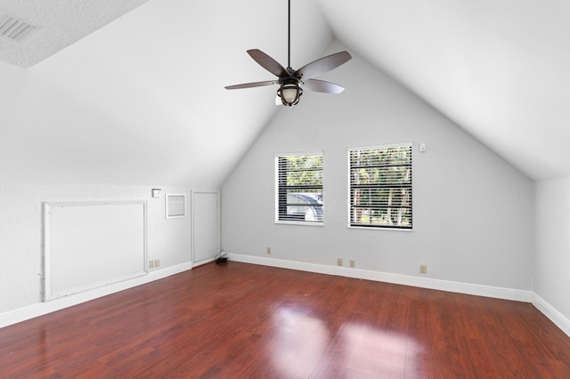 bonus room with ceiling fan, vaulted ceiling, and dark hardwood / wood-style flooring