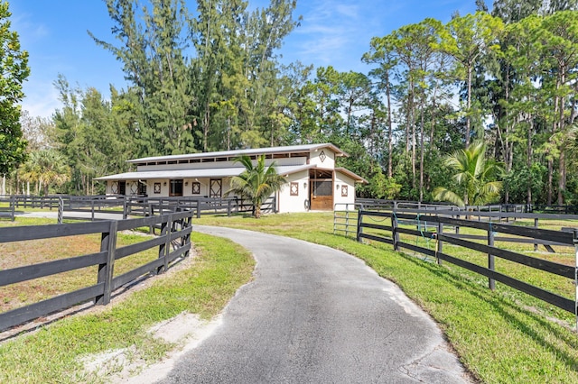 view of stable featuring a rural view