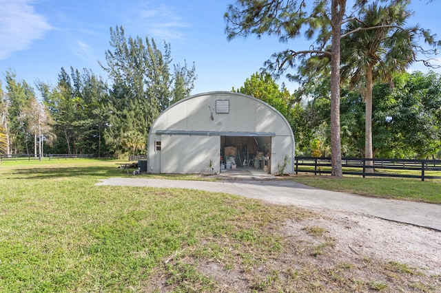 view of outdoor structure featuring a yard