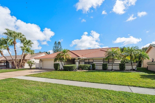 single story home with a garage and a front yard