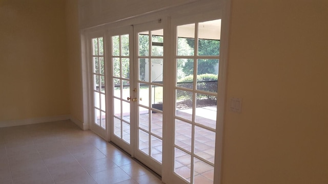 doorway featuring french doors and light tile patterned floors