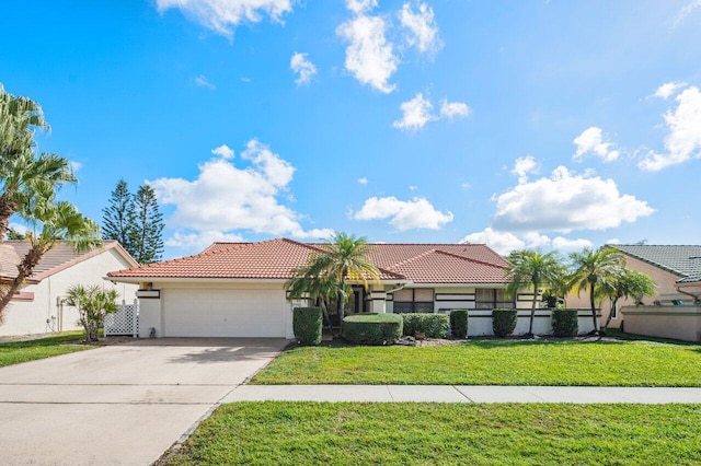 view of front of property featuring a garage and a front yard