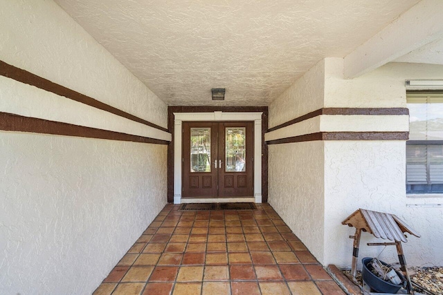 entrance to property featuring french doors