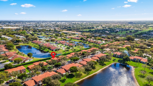 bird's eye view with a water view and a residential view