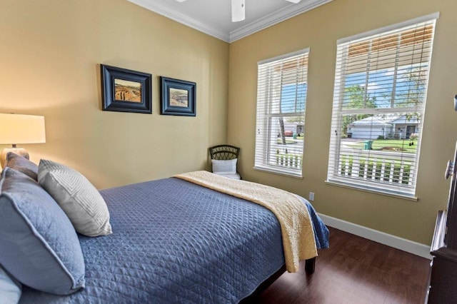 bedroom featuring ornamental molding, dark hardwood / wood-style floors, and ceiling fan