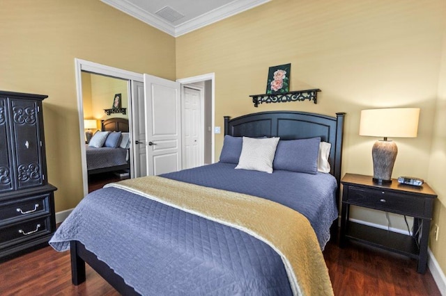 bedroom featuring dark hardwood / wood-style flooring, ornamental molding, and a closet