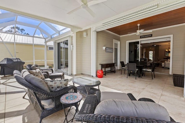 view of patio / terrace with a grill, a lanai, outdoor lounge area, and ceiling fan