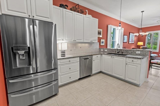 kitchen with sink, ornamental molding, kitchen peninsula, stainless steel appliances, and white cabinets