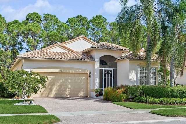 mediterranean / spanish house with a garage