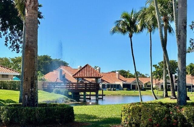 22663 Meridiana Dr, Boca Raton, FL 33433 - surrounding community with a water view and a lawn