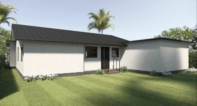 215 32nd St, West Palm Beach, FL 33407 - view of front facade featuring a standing seam roof, a front yard, stucco siding, and metal roof