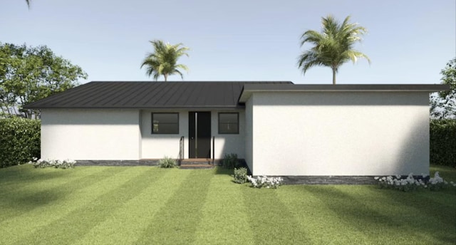 215 32nd St, West Palm Beach, FL 33407 - view of front of house featuring stucco siding and a front lawn