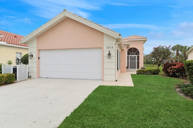 view of front facade with a front lawn and a garage