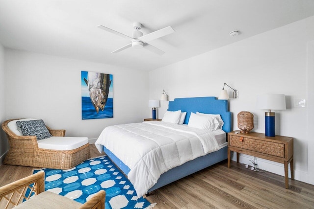 bedroom featuring wood finished floors and a ceiling fan