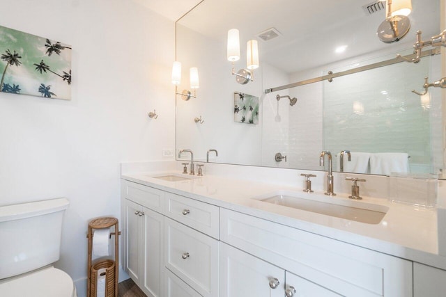 full bathroom with toilet, a stall shower, visible vents, and a sink