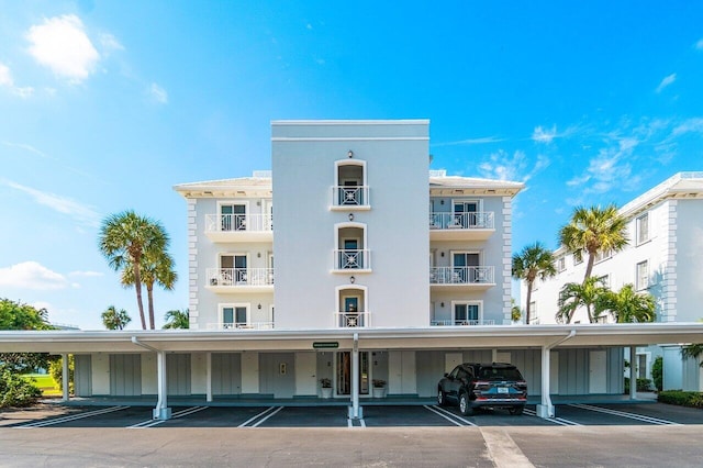 view of building exterior with covered parking