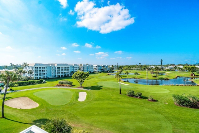 view of home's community featuring a water view and golf course view