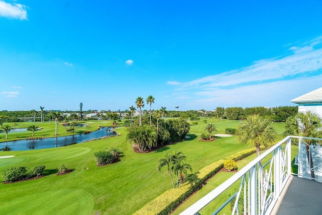 exterior space featuring golf course view and a water view