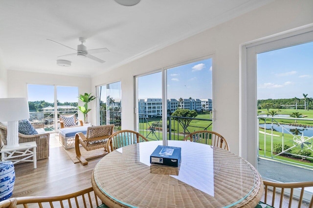 sunroom featuring ceiling fan