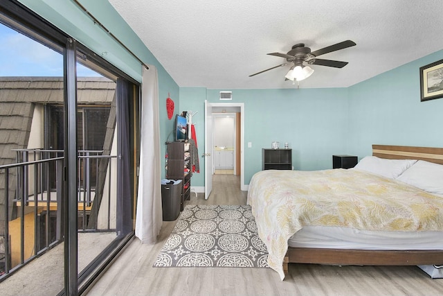 bedroom with ceiling fan, access to exterior, a textured ceiling, and light wood-type flooring