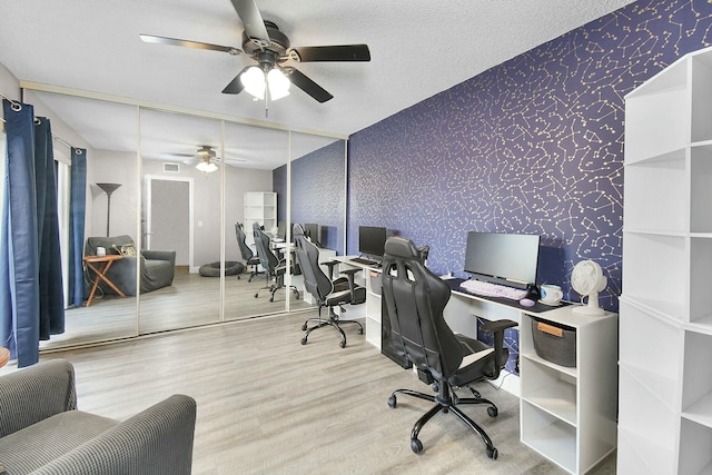 office featuring hardwood / wood-style flooring and a textured ceiling