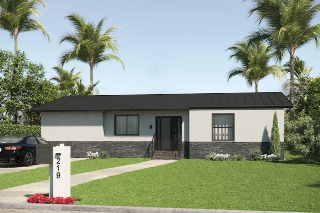 219 32nd St, West Palm Beach, FL 33407 - view of front of property with stone siding, stucco siding, a standing seam roof, a front yard, and metal roof