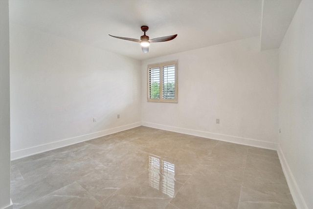 spare room with ceiling fan