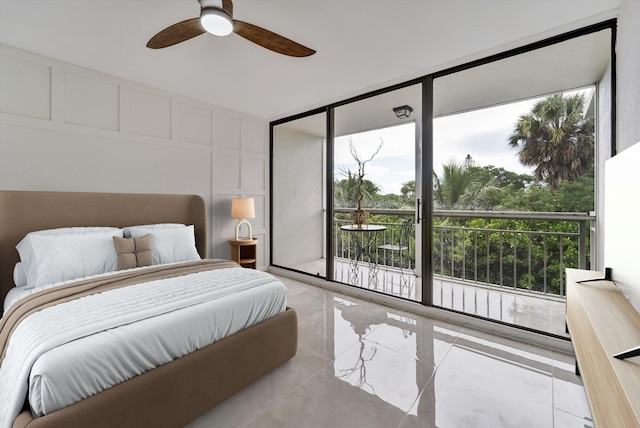 bedroom featuring floor to ceiling windows and ceiling fan