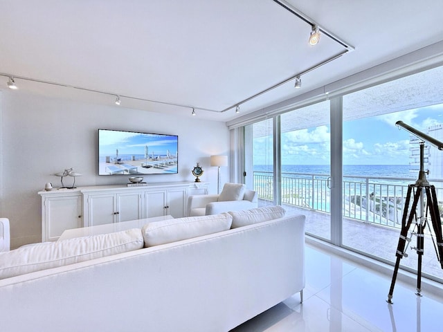 living room featuring expansive windows and track lighting